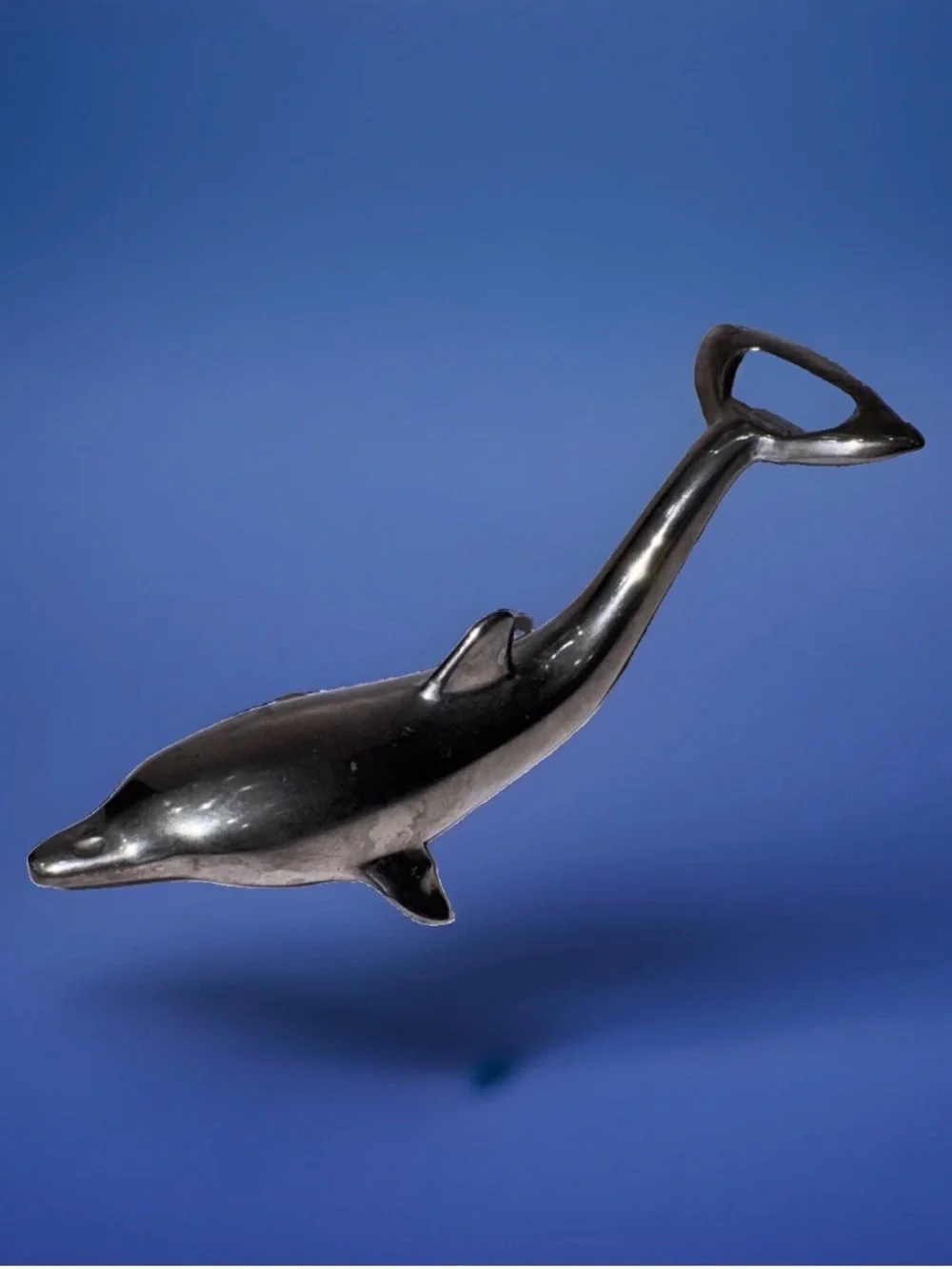 Sleek silver-plated Dolphin bottle opener